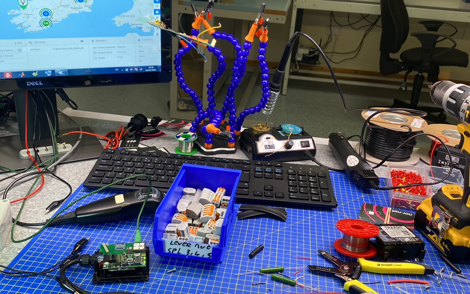 Traxsit engineering workbench with GPS tracking components and the Traxsit live map on screen