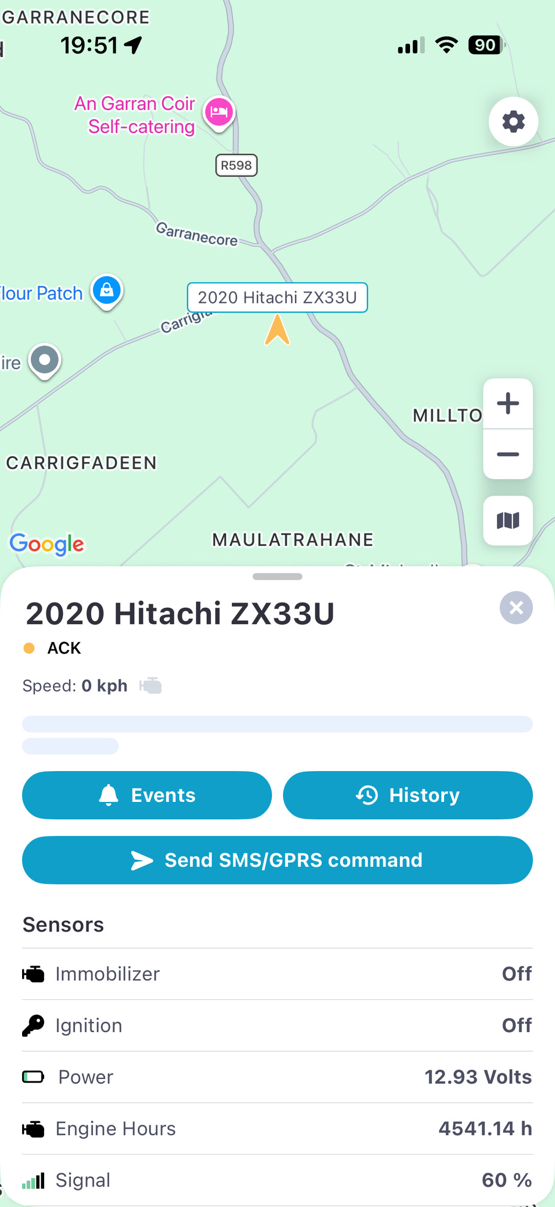 Traxsit tracking app on iPhone showing a plant machine on the live map with engine hours, immobiliser and sensor status